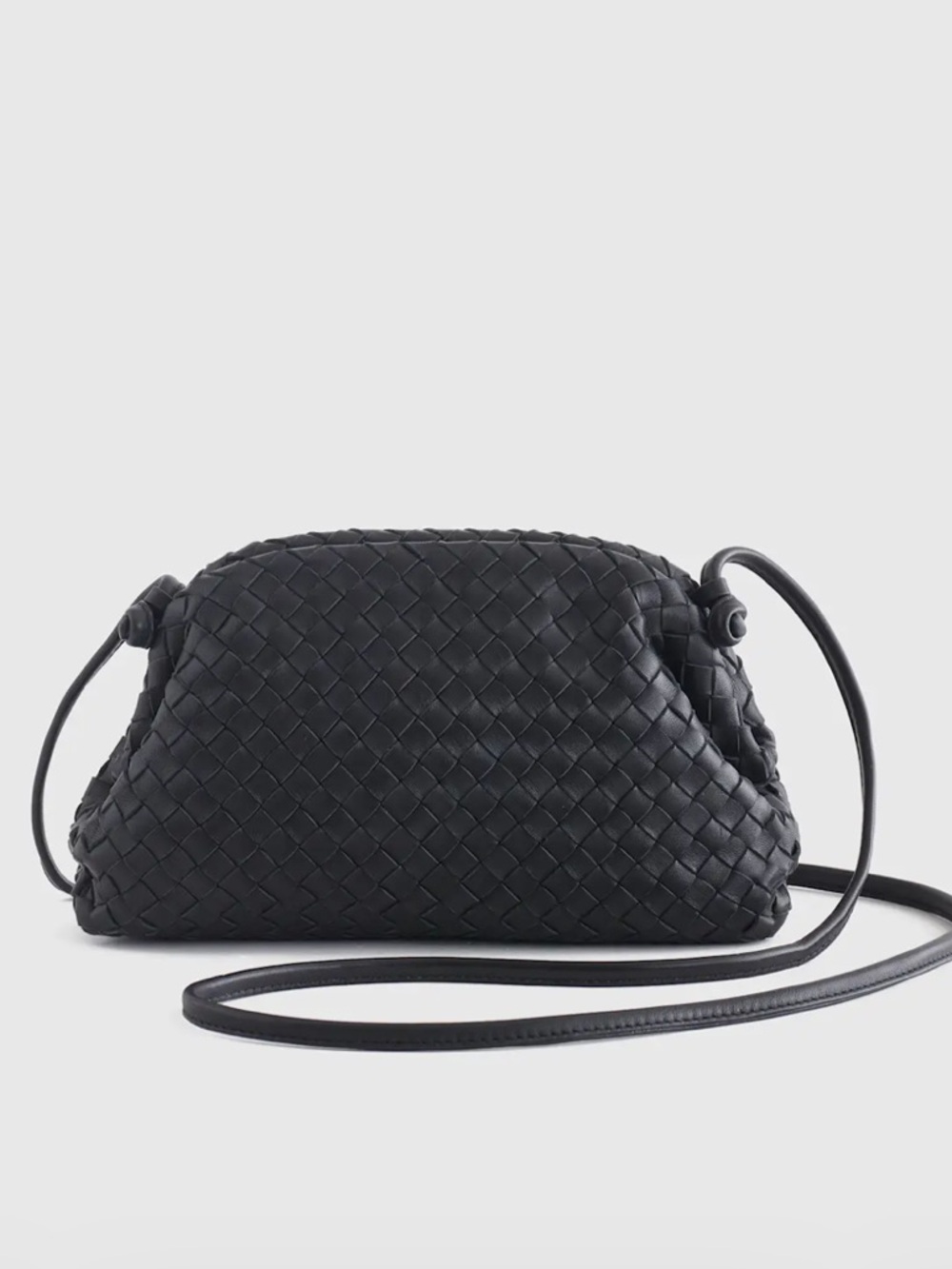 Quince woven leather pouch bag